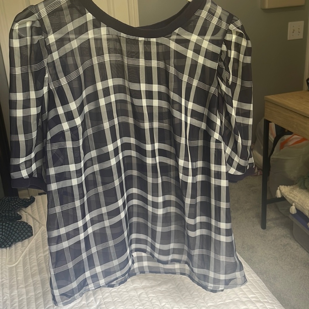 A new day is the brand it’s a large and it’s navy blue with white stripes